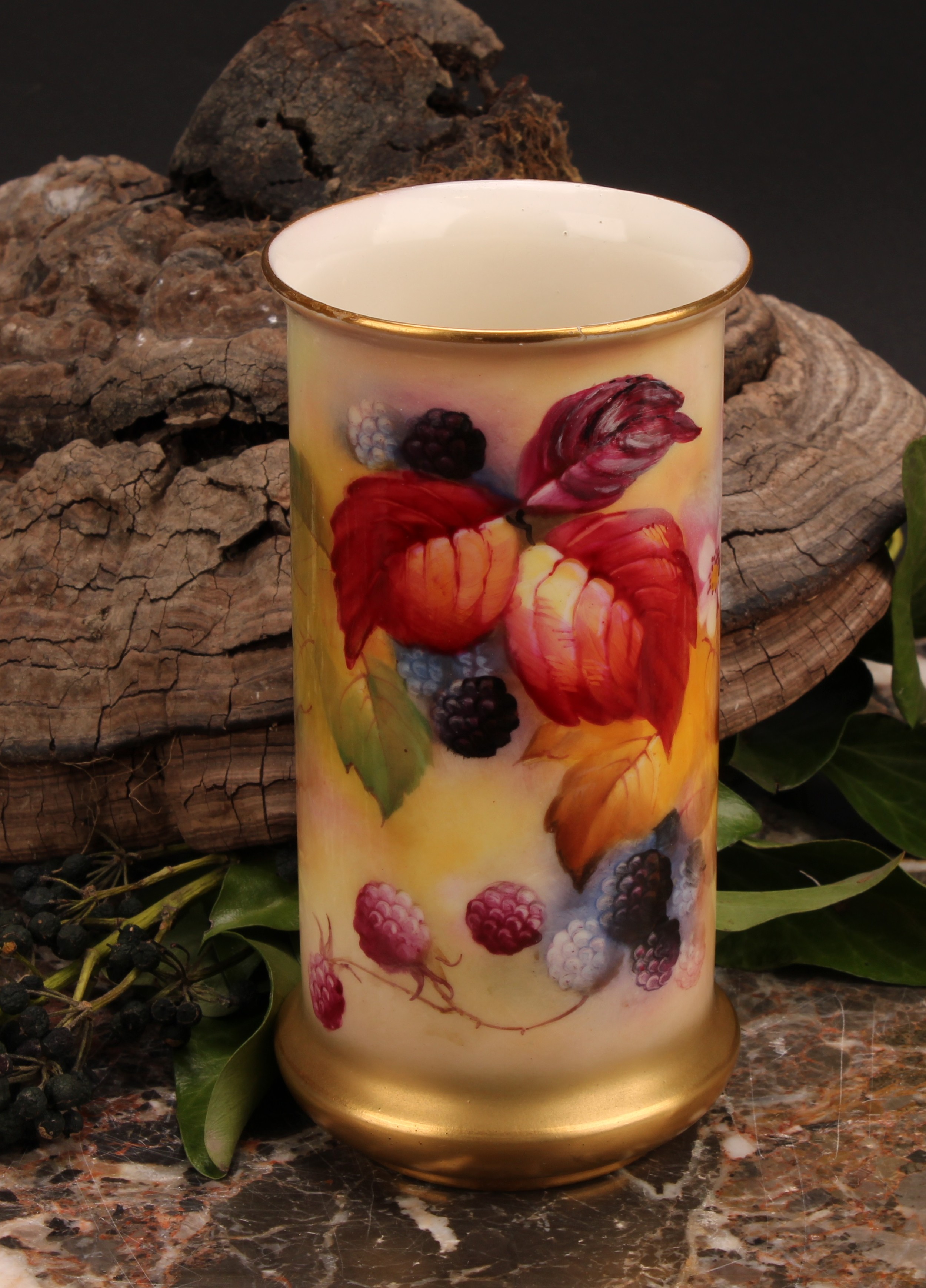 A Royal Worcester cylindrical vase, painted by Kitty Blake, signed, with autumnal leaves and berries