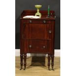 A Post-Regency mahogany bedroom night cupboard, rectangular top with channelled edge and three-