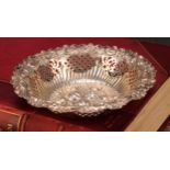 A Victorian silver shaped circular sweetmeat dish, the field chased in bold relief with leaves and