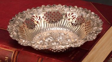 A Victorian silver shaped circular sweetmeat dish, the field chased in bold relief with leaves and