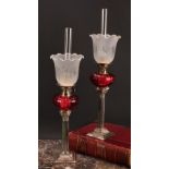 A pair of EPNS Corinthian column table oil lamps, frilled shades, fluted glass reservoirs, 54cm high