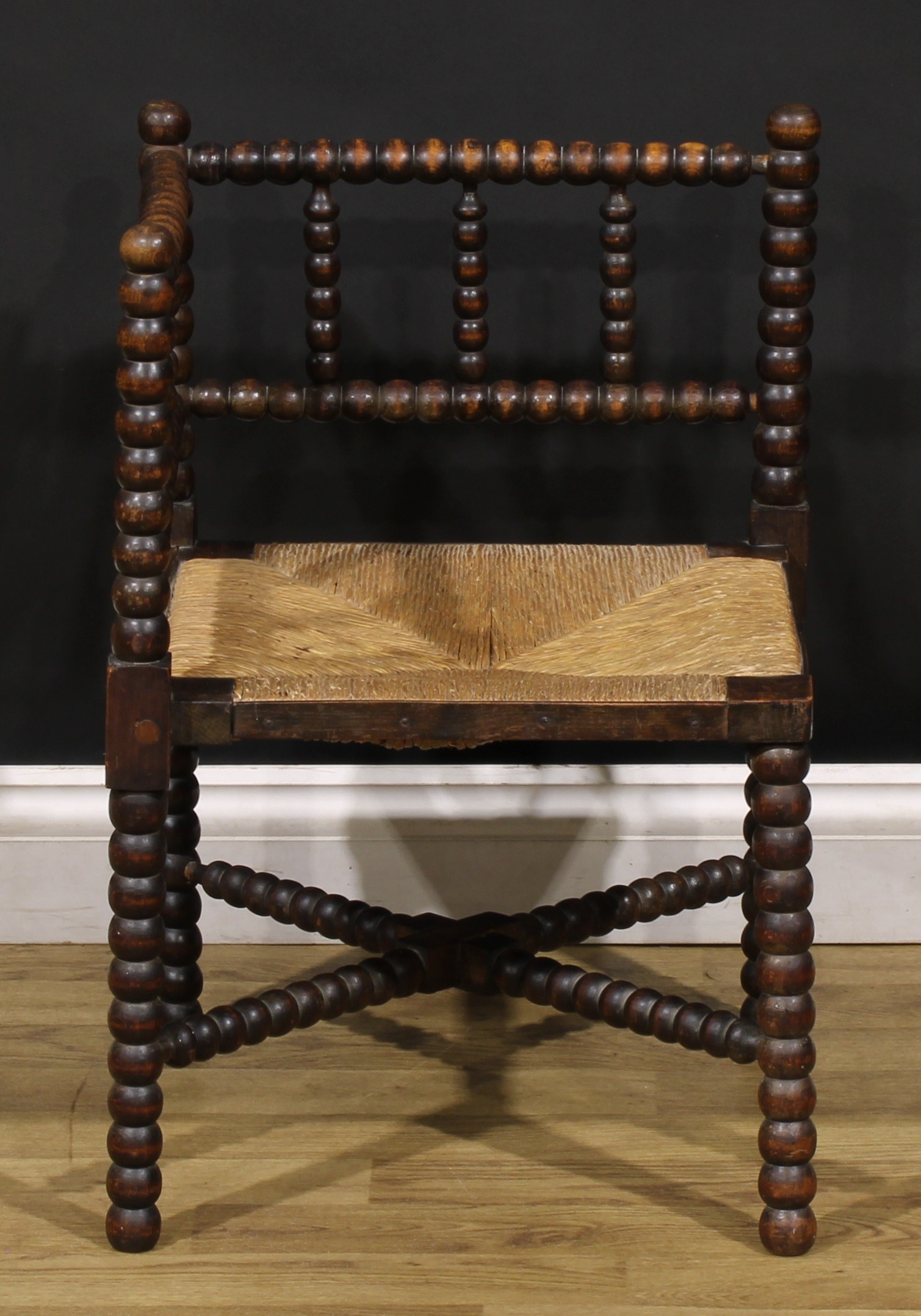 An Arts & Crafts beech bobbin-turned corner chair, of small proportions, rush seat, 60.5cm high, - Image 2 of 4