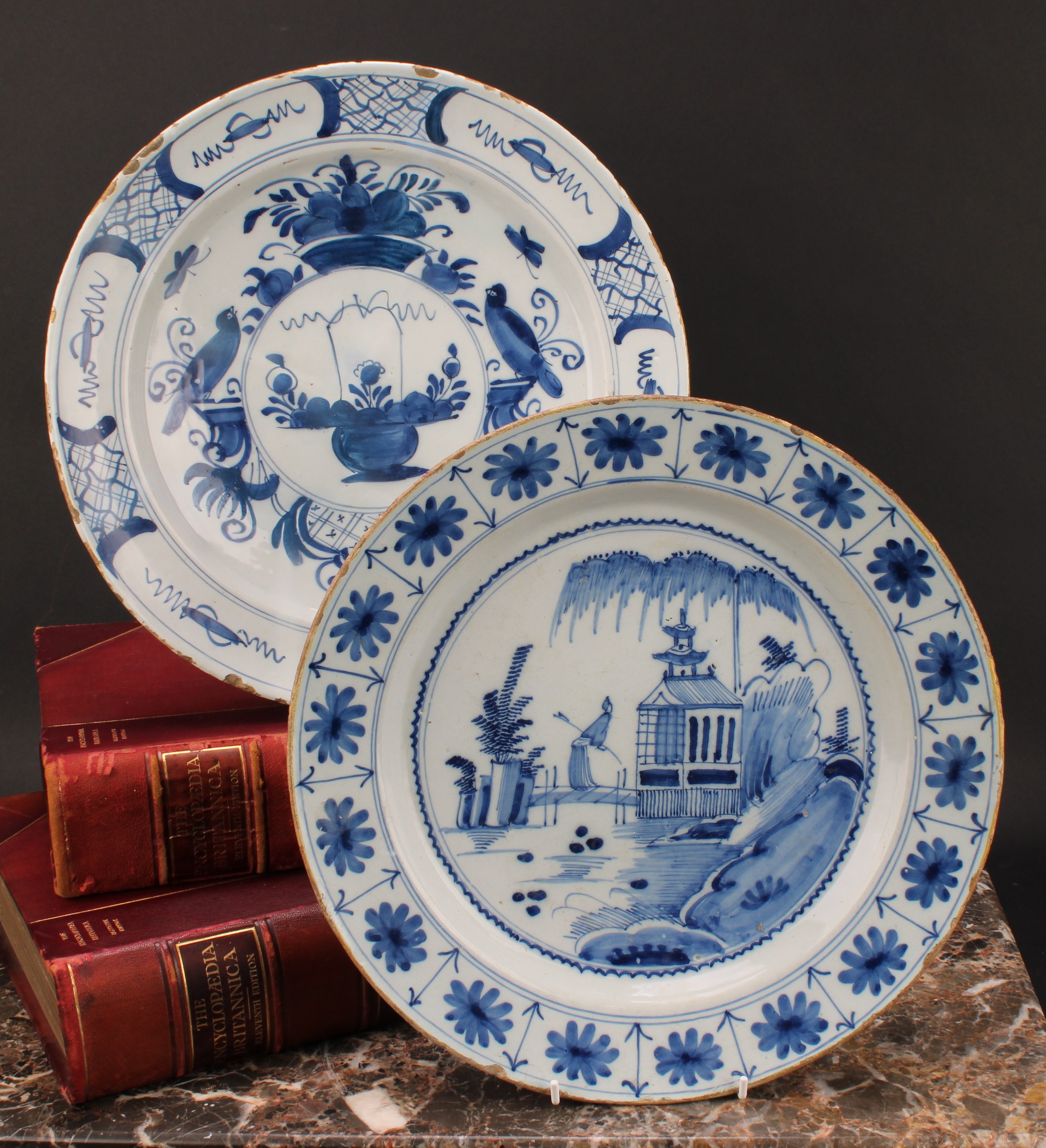 An 18th century Delft circular charger, painted in underglaze blue in the Chinese taste, with