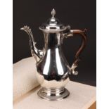 A George III silver baluster coffee pot, quite plain, hinged domed cover with wrythen finial,