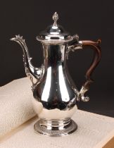A George III silver baluster coffee pot, quite plain, hinged domed cover with wrythen finial,