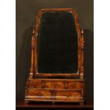 A George I style walnut and mahogany dressing glass, shaped mirror plate, the base with an