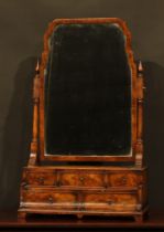 A George I style walnut and mahogany dressing glass, shaped mirror plate, the base with an