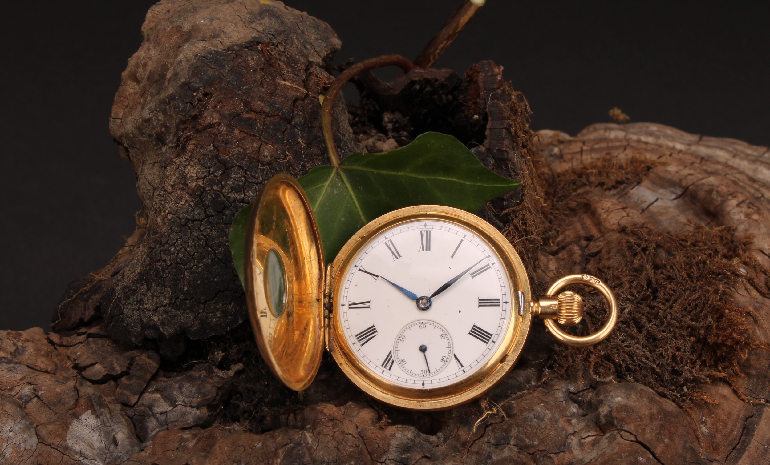 A lady's 18ct gold half hunter pocket watch, white enamel dial, Roman numerals, subsidiary seconds
