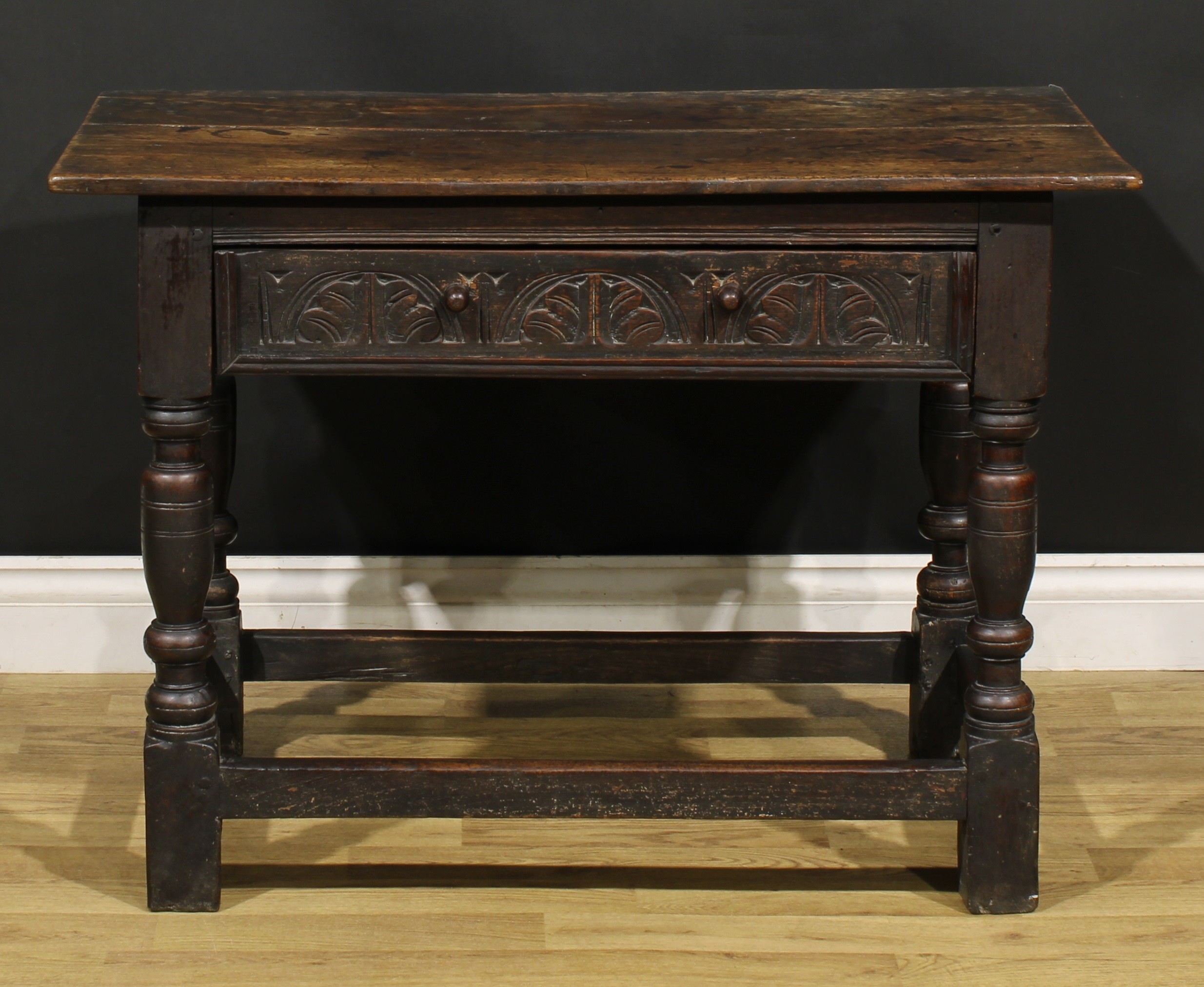 A 17th century oak side table, oversailing top above a long frieze drawer carved with leafy - Image 2 of 6