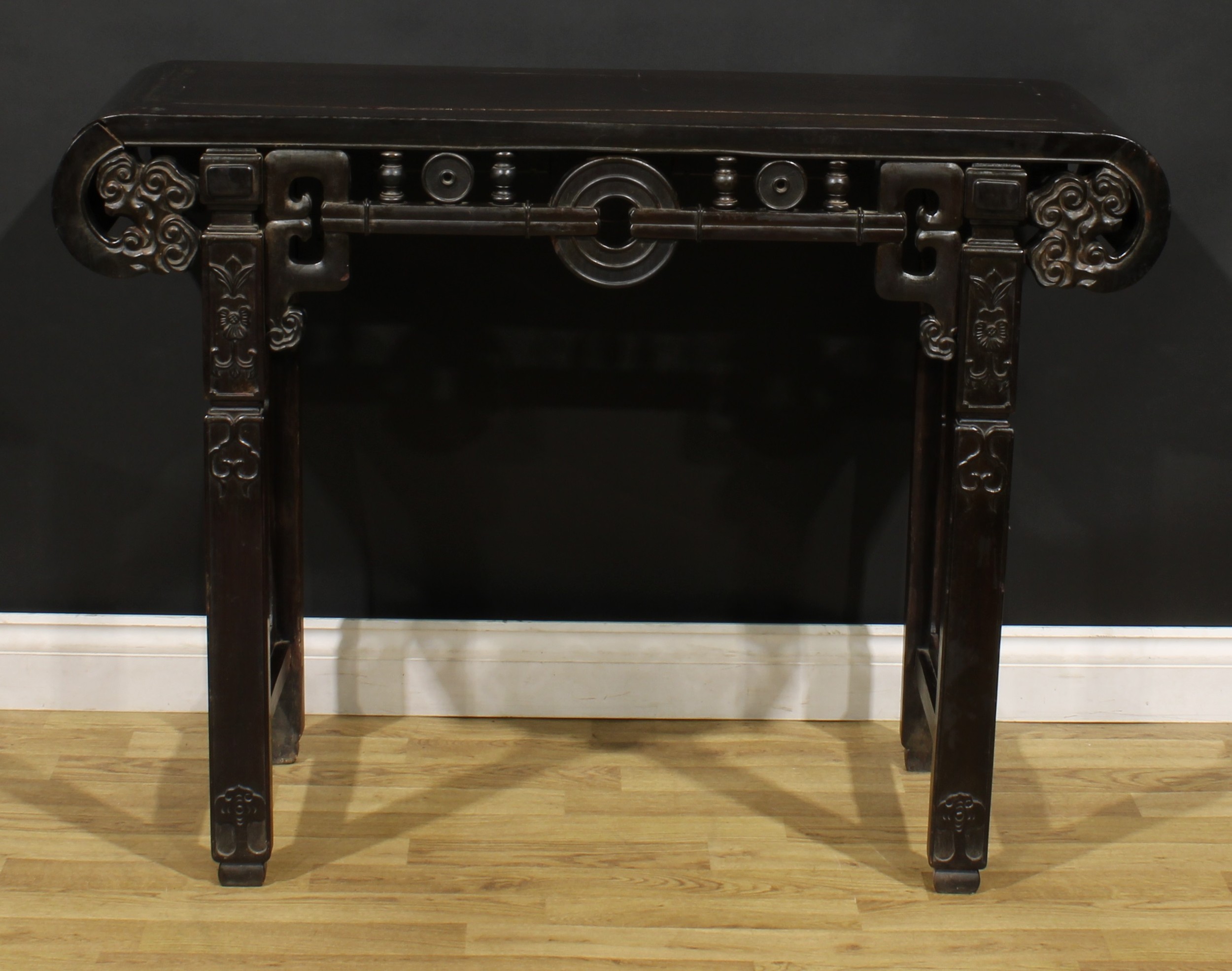 A Chinese hardwood altar table, rectangular top with scroll ends carved with ruyi heads, shaped - Image 2 of 3