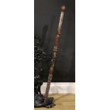 Tribal Art - a Polynesian hardwood staff or walking stick, carved with janus figures and faces,
