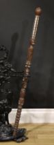 Tribal Art - a Polynesian hardwood staff or walking stick, carved with janus figures and faces,
