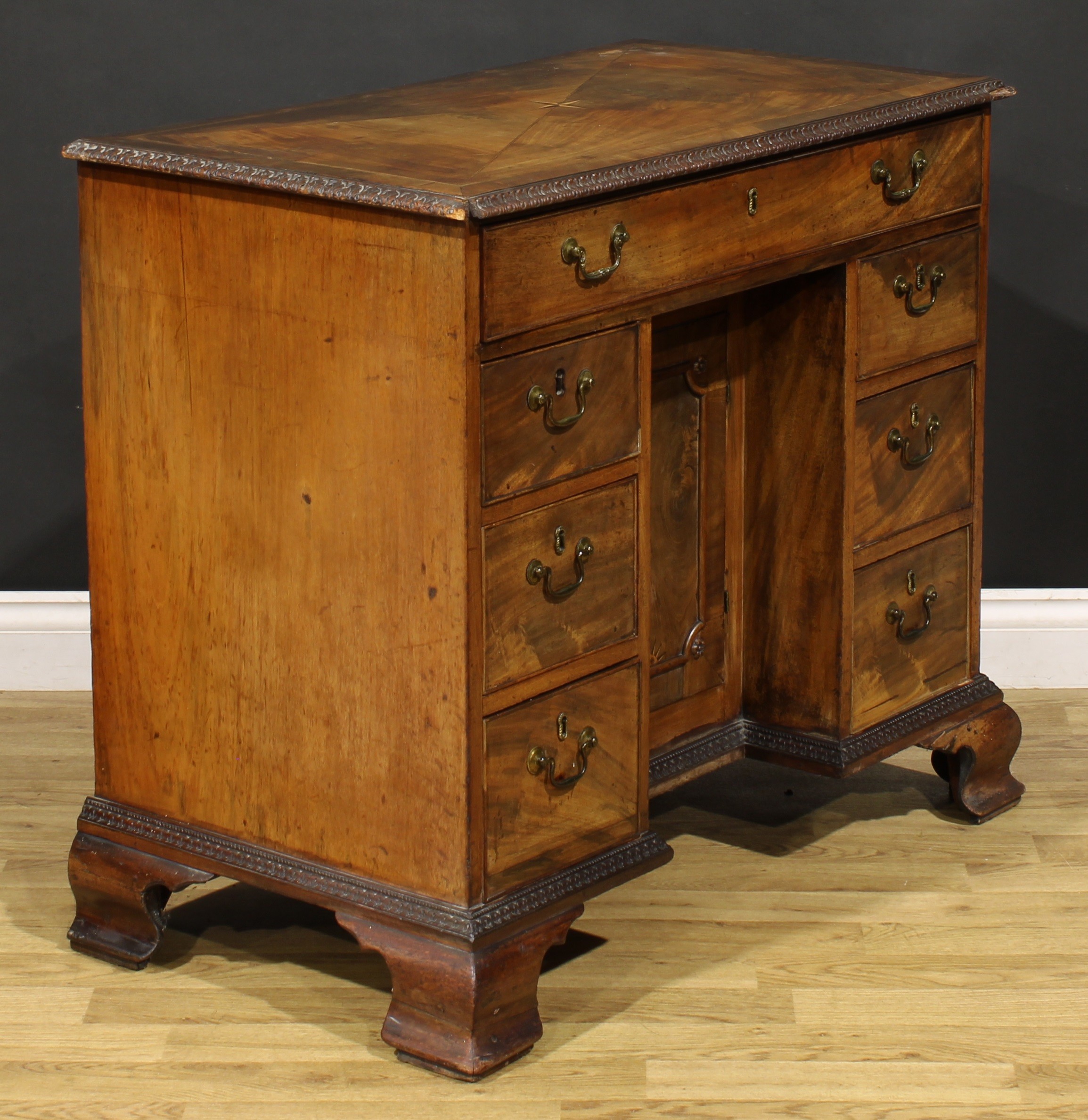 A George III mahogany kneehole desk, rectangular top with moulded foliate carved edge centred by a - Image 3 of 6