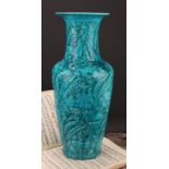 A Chinese ovoid vase, glazed in turquoise, moulded in the Archaic manner, with stylised deer and