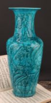 A Chinese ovoid vase, glazed in turquoise, moulded in the Archaic manner, with stylised deer and