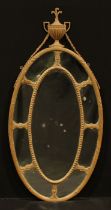 A 19th century Neo-Classical softwood and gesso oval looking glass, the mirror plate crested by an
