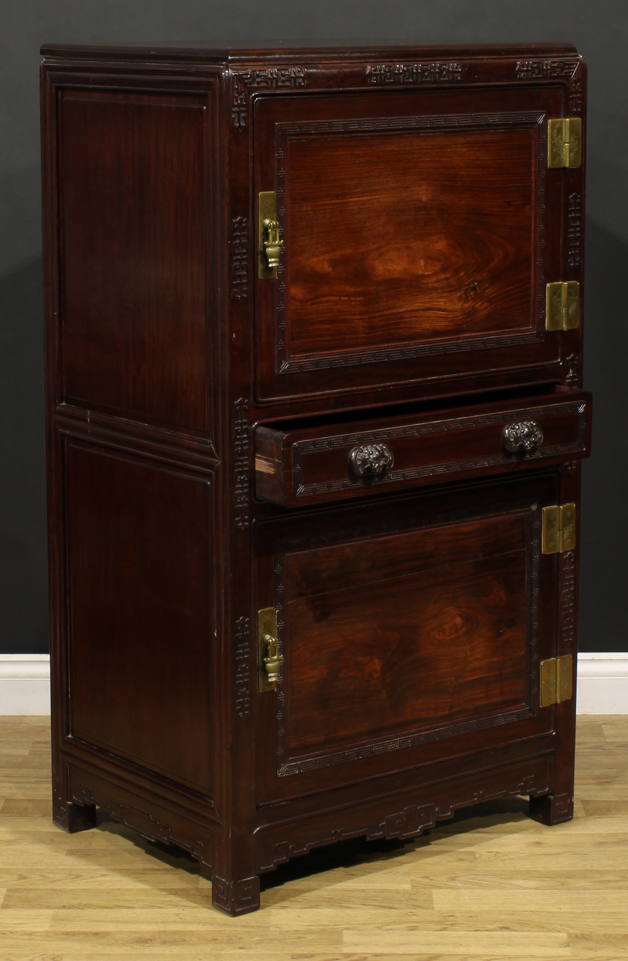 A Chinese hardwood side cabinet, moulded rectangular top above two panel doors centred by a long - Image 3 of 5