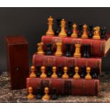 An early 20th century boxwood and ebonised tournament size chess set, the Kings 9.5cm high, mahogany
