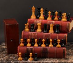 An early 20th century boxwood and ebonised tournament size chess set, the Kings 9.5cm high, mahogany