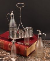 A George III Old Sheffield Plate four bottle cruet, in the Neo-Classical taste, reeded and bright-