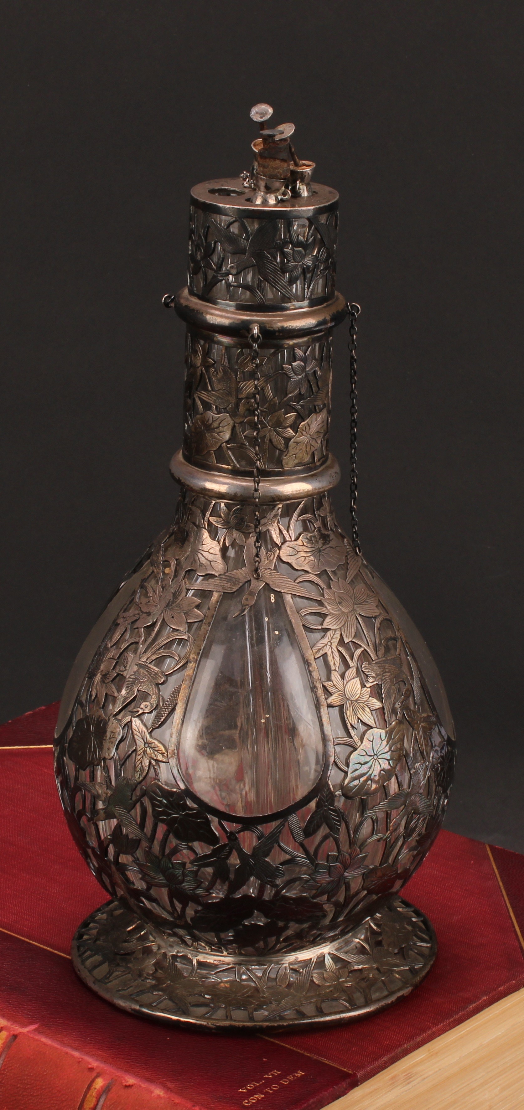 A Chinese silver mounted four-section decanter, the fittings pierced and engraved with with water