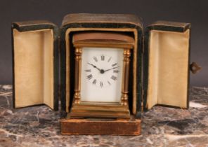 An early 20th century lacquered brass miniature carriage timepiece, 4cm rectangular enamel dial