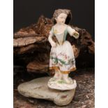 A Meissen porcelain figure, of a girl wearing a floral dress, with posies in hand, scroll base,