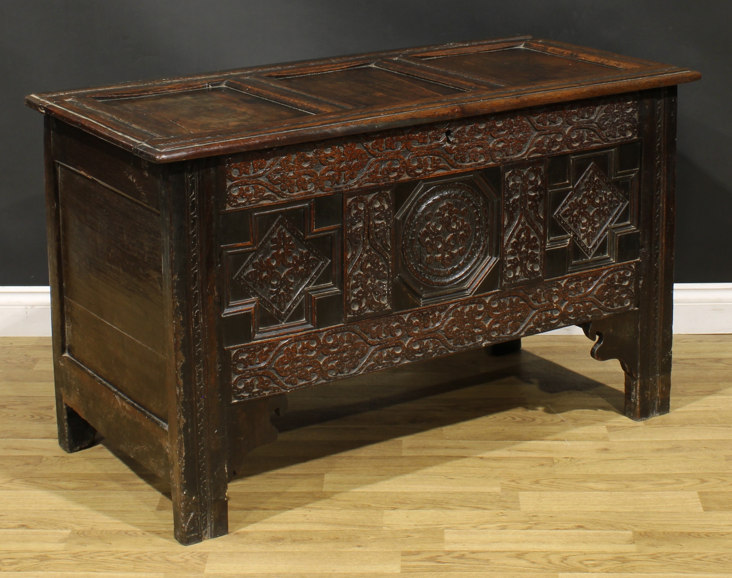 A Charles II oak three panel blanket chest, hinged top, the front profusely carved with leafy - Image 2 of 5