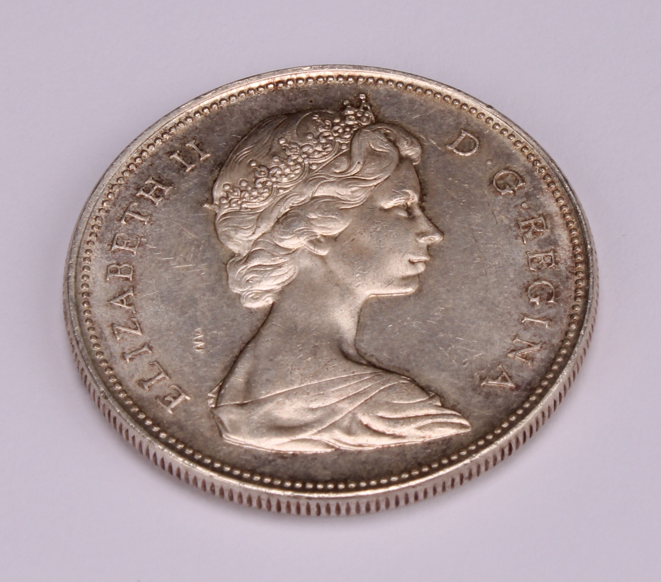 Coins - an Elizabeth II silver Canadian dollar, small beads, 1966 - Image 3 of 3