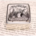 A Victorian silver and enamel vesta case, hinged cover decorated with Mr Punch and Toby, striker