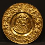 Interior Decoration - a large sheet brass wall-hanging charger, embossed with a portrait of the 17th