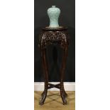 A Chinese hardwood jardiniere stand, circular top with foliate carved edge and inset marble panel,