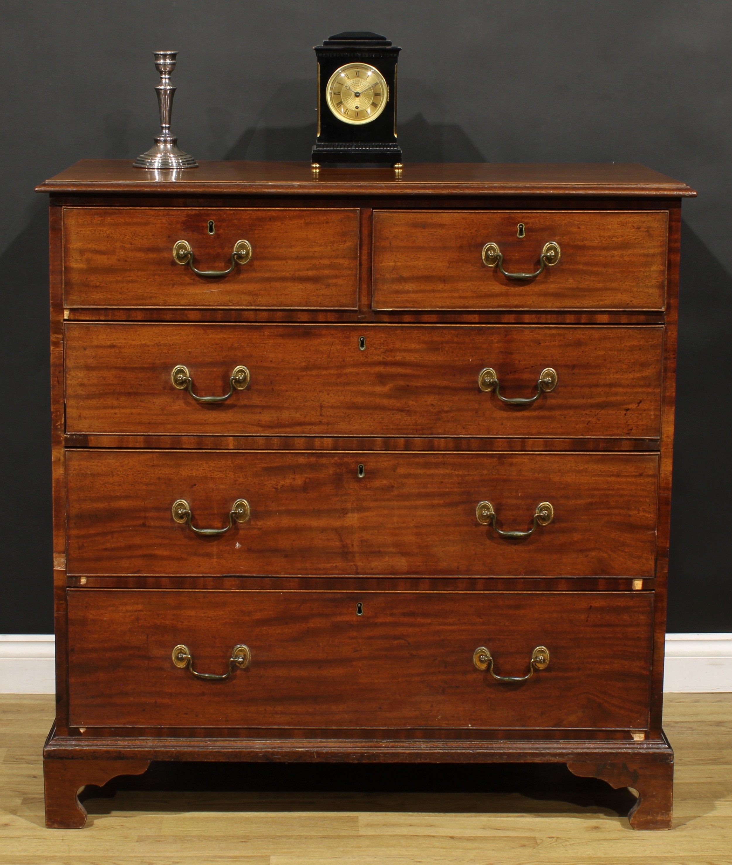 A George III mahogany chest, rectangular top with moulded edge above two short and three long