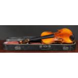 A violin, the one-piece back 36cm long excluding button, ebonised tuning pegs, outlined with