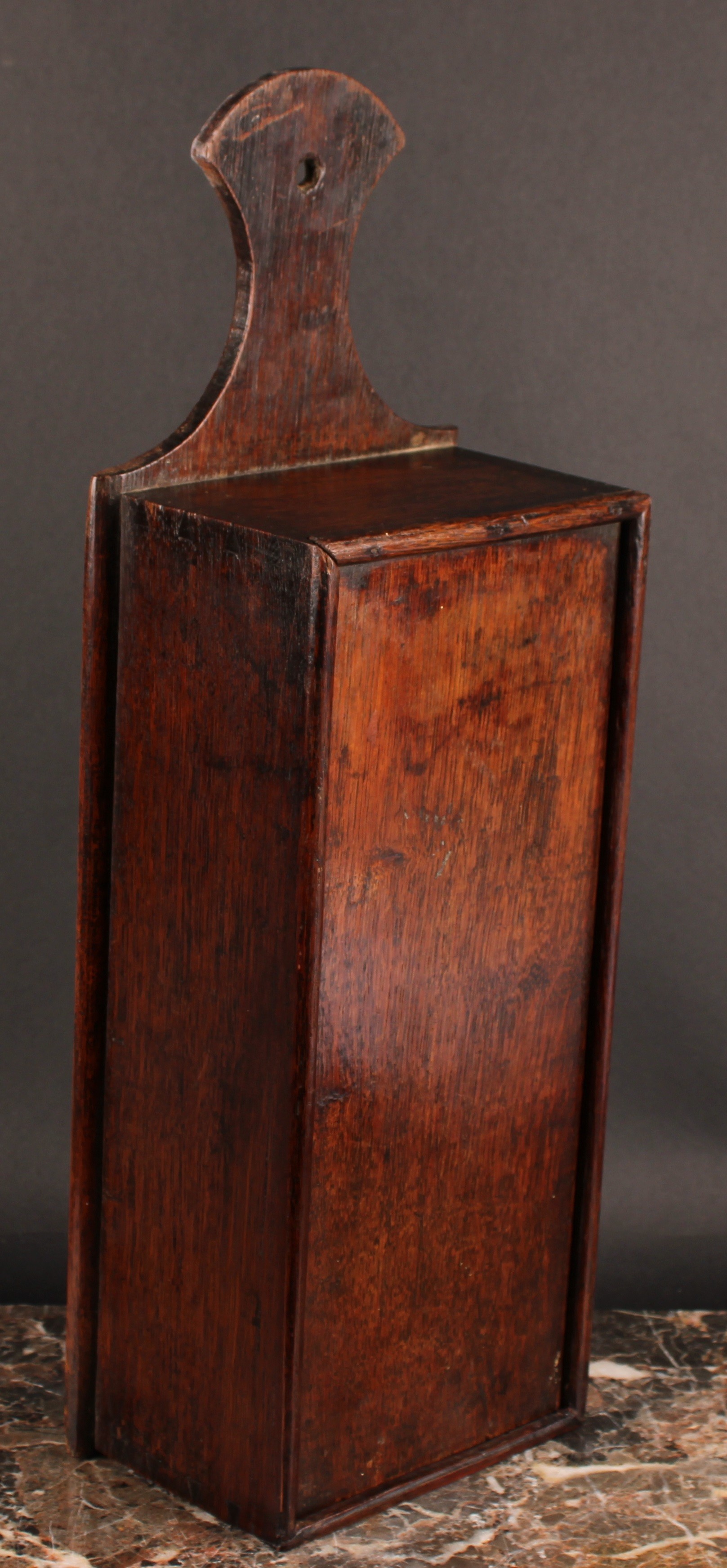 A George III oak candle box, axe-head shaped cresting, sliding cover, 50cm high, c.1800 - Image 2 of 3