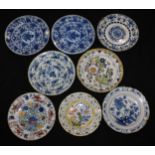 A collection of eight 18th and early 19th century Delft chargers, the largest 35cm diameter (8)