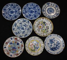 A collection of eight 18th and early 19th century Delft chargers, the largest 35cm diameter (8)