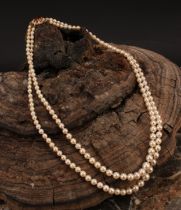 A Victorian style pearl necklace, the two graduated rows of pearls with a 9ct gold clasp, set with a