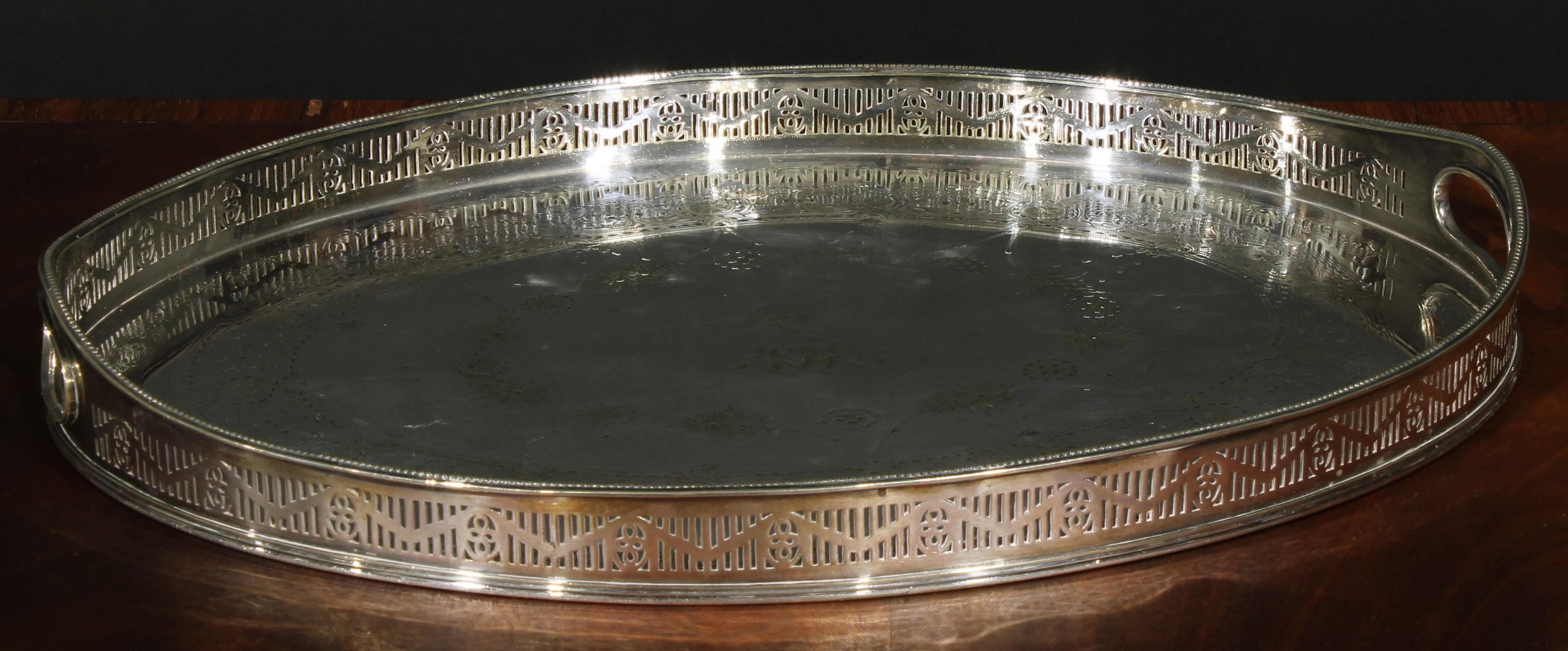 A Victorian E.P.N.S oval gallery tray, of George III Neo-Classical design, pierced border, the field