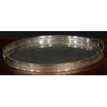 A Victorian E.P.N.S oval gallery tray, of George III Neo-Classical design, pierced border, the field
