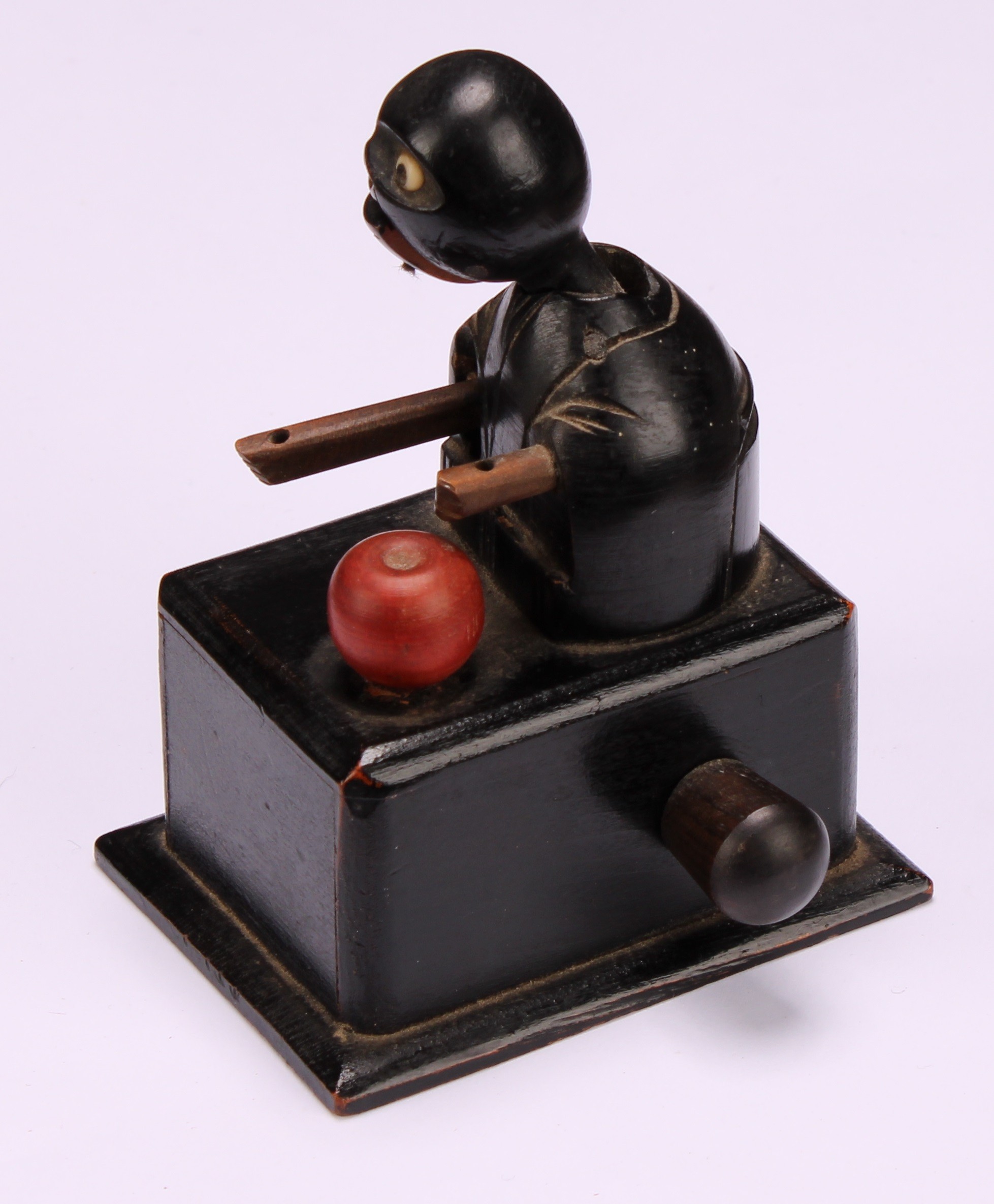 A Japanese Kobe mechanical wooden toy, as a comical figure eating an apple, rectangular base, 9cm - Image 3 of 4