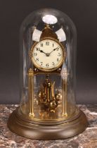 An early 20th century brass dome timepiece, 7cm circular enamel clock dial inscribed with Arabic