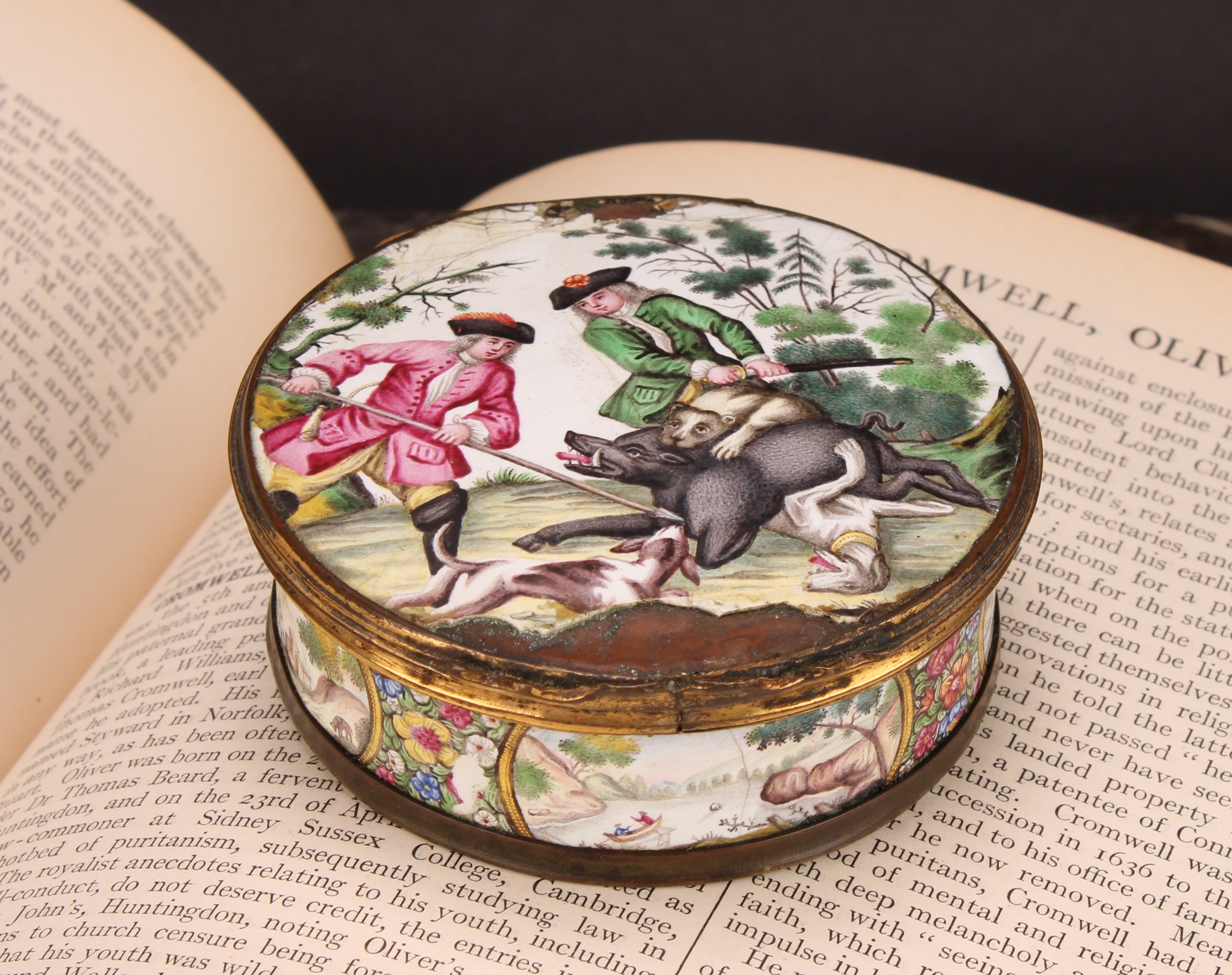 An 18th century enamel circular table snuff box, the stand-away hinged cover painted in polychrome