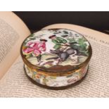 An 18th century enamel circular table snuff box, the stand-away hinged cover painted in polychrome