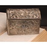 An early 20th century silver coloured metal rectangular casket, probably South American, chased with