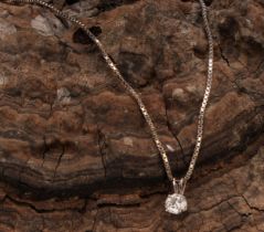 A diamond solitaire pendant, the round brilliant cut stone claw set, approximately 0.8ct diamond