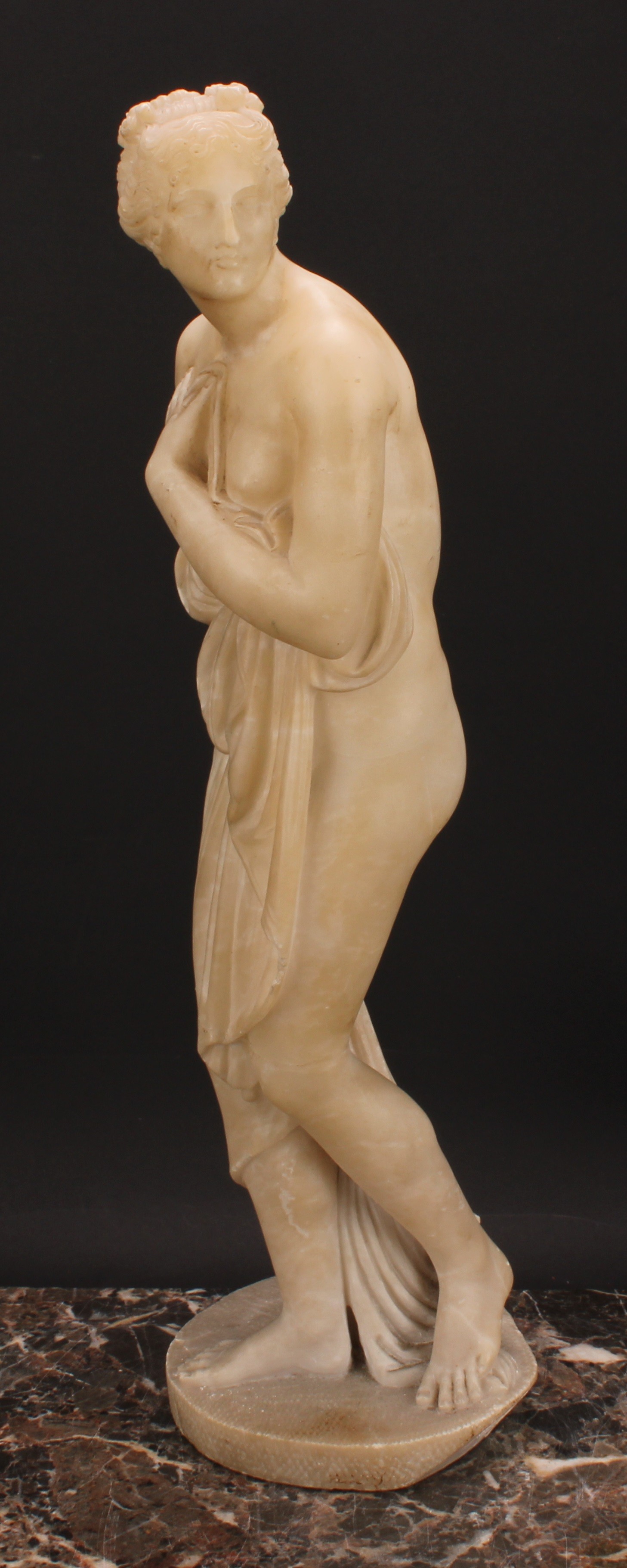 A 19th century alabaster figure, Venus Bathing, after the Antique, circular base, 53cm high - Image 3 of 4