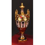 A Royal Crown Derby Imari 1128 pattern two handled pedestal vase and cover, solid gold band, first