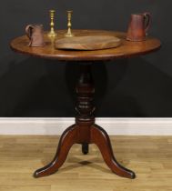 A George III Provincial oak tripod occasional table, circular tilting top, turned baluster pillar,