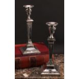 A pair of large Victorian Adam Revival square table candlesticks, embossed in the Neo-Classical